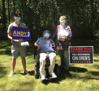 Sue Marticek outdoors with Tom Spadaro in his wheelchair