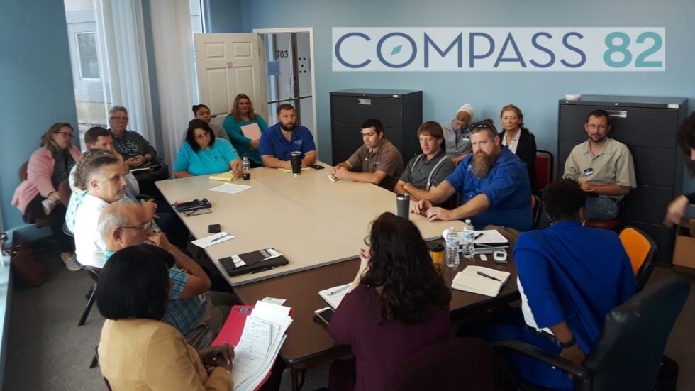 Bridget Holmes at a conference table with non-profit builders in Panama City