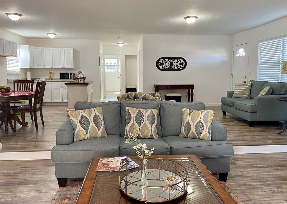 Home interior after reconstruction shows new walls, flooring and furniture