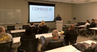 Sue Marticek at podium in front of classroom